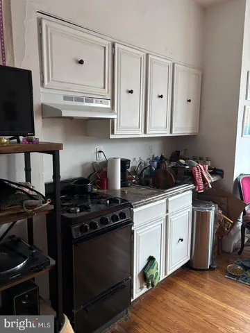a kitchen with stainless steel appliances granite countertop a stove and a microwave
