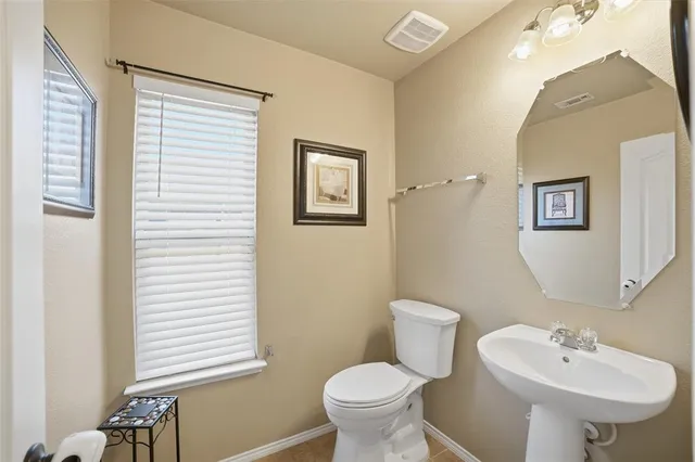 a bathroom with a sink and a toilet