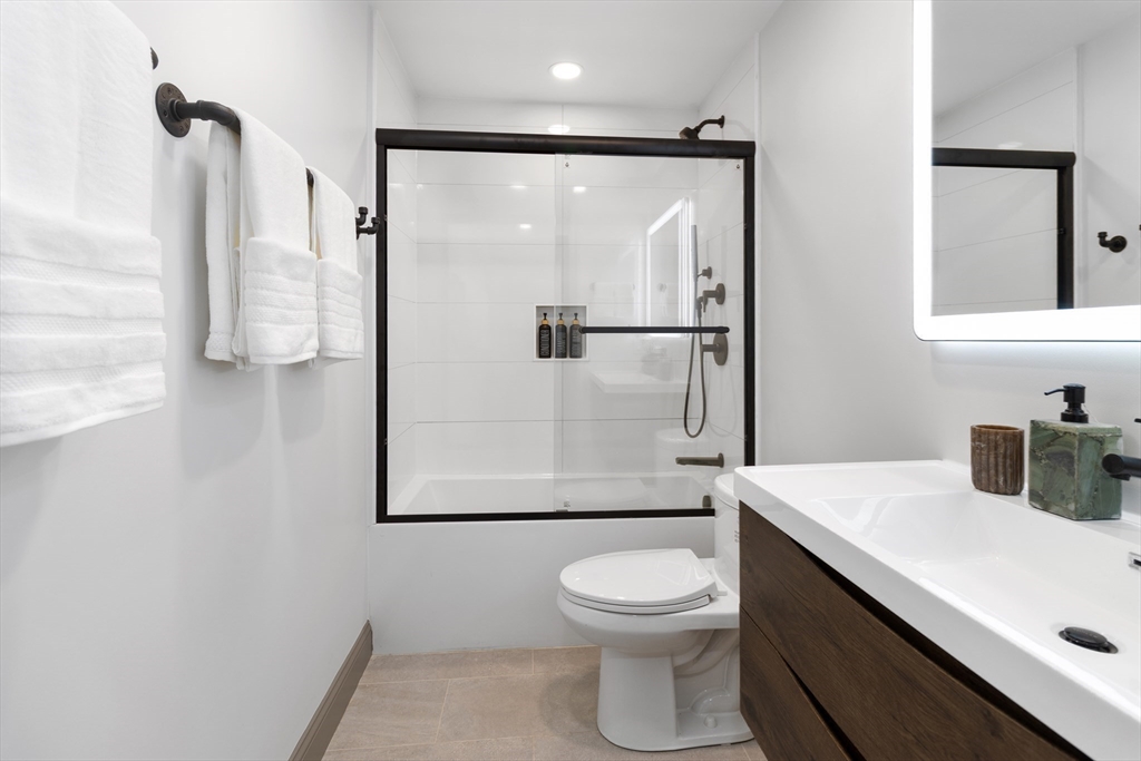 4 Snelling Place, Unit 4 Boston, MA 02113 - Photo 13 of 15 a bathroom with a toilet sink and shower