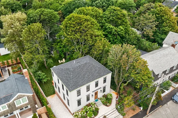 an aerial view of a house having yard patio and entertaining space
