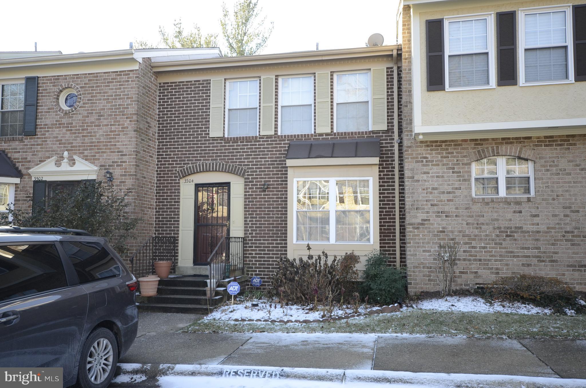 3504 Banquo Drive, Unit 893 Silver Spring, MD 20906 - Photo 1 of 23 a front view of a house with a garden