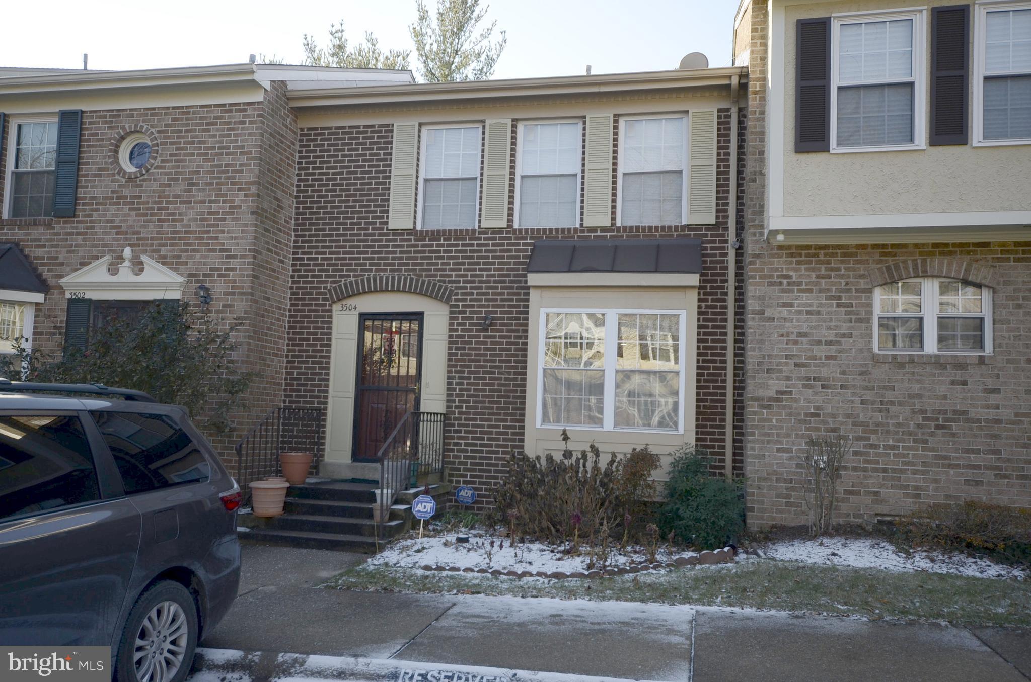 3504 Banquo Drive, Unit 893 Silver Spring, MD 20906 - Photo 2 of 23 a front view of a house with parking space