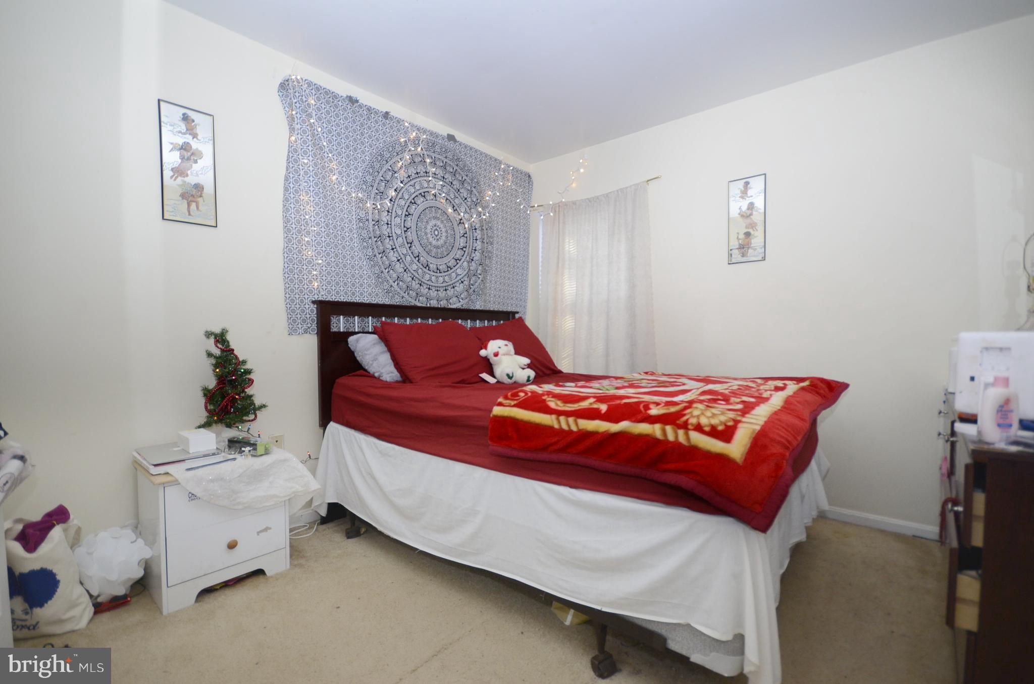 3504 Banquo Drive, Unit 893 Silver Spring, MD 20906 - Photo 14 of 23 a bedroom with a bed and a window
