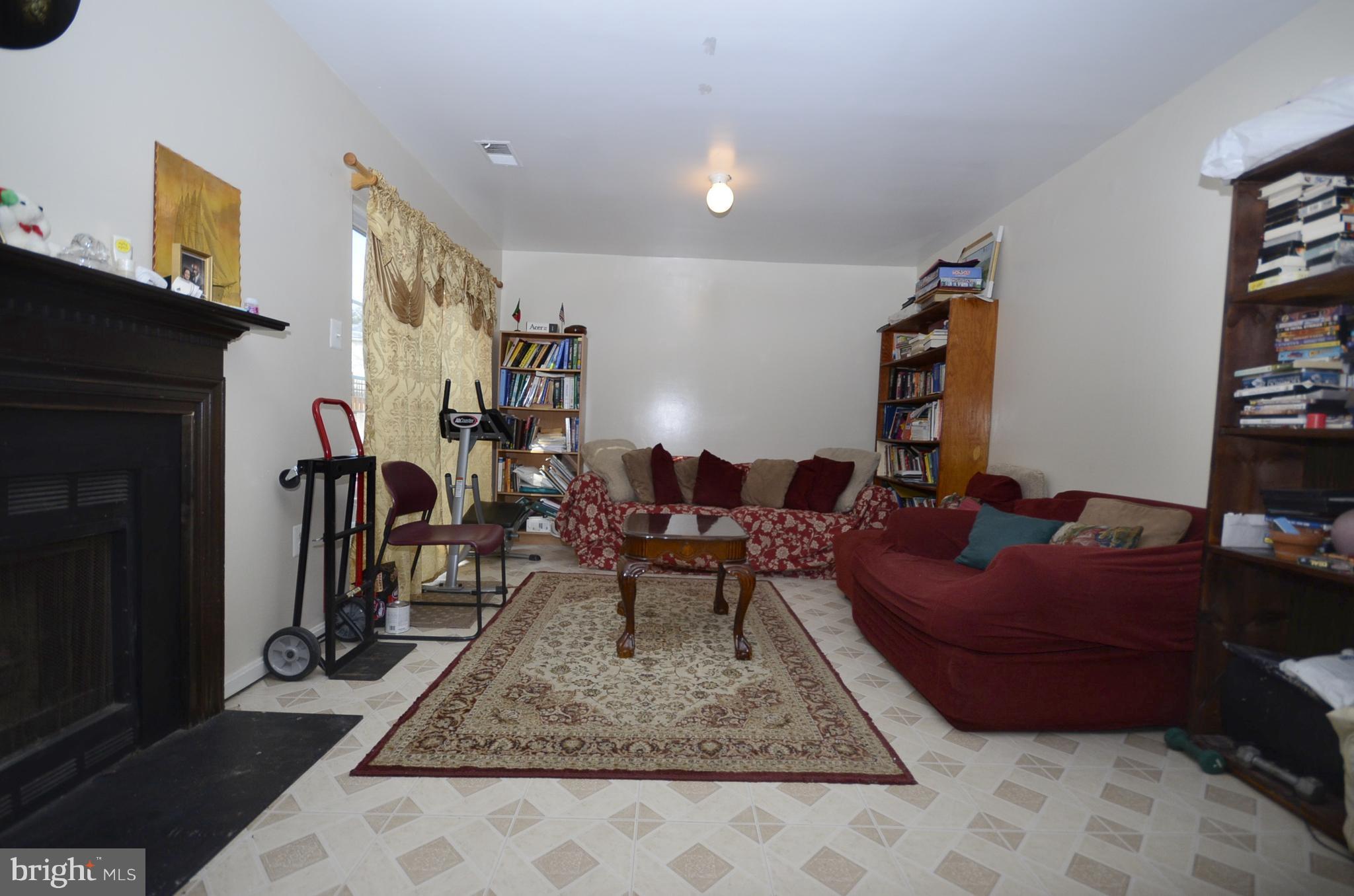 3504 Banquo Drive, Unit 893 Silver Spring, MD 20906 - Photo 17 of 23 a living room with furniture and a rug