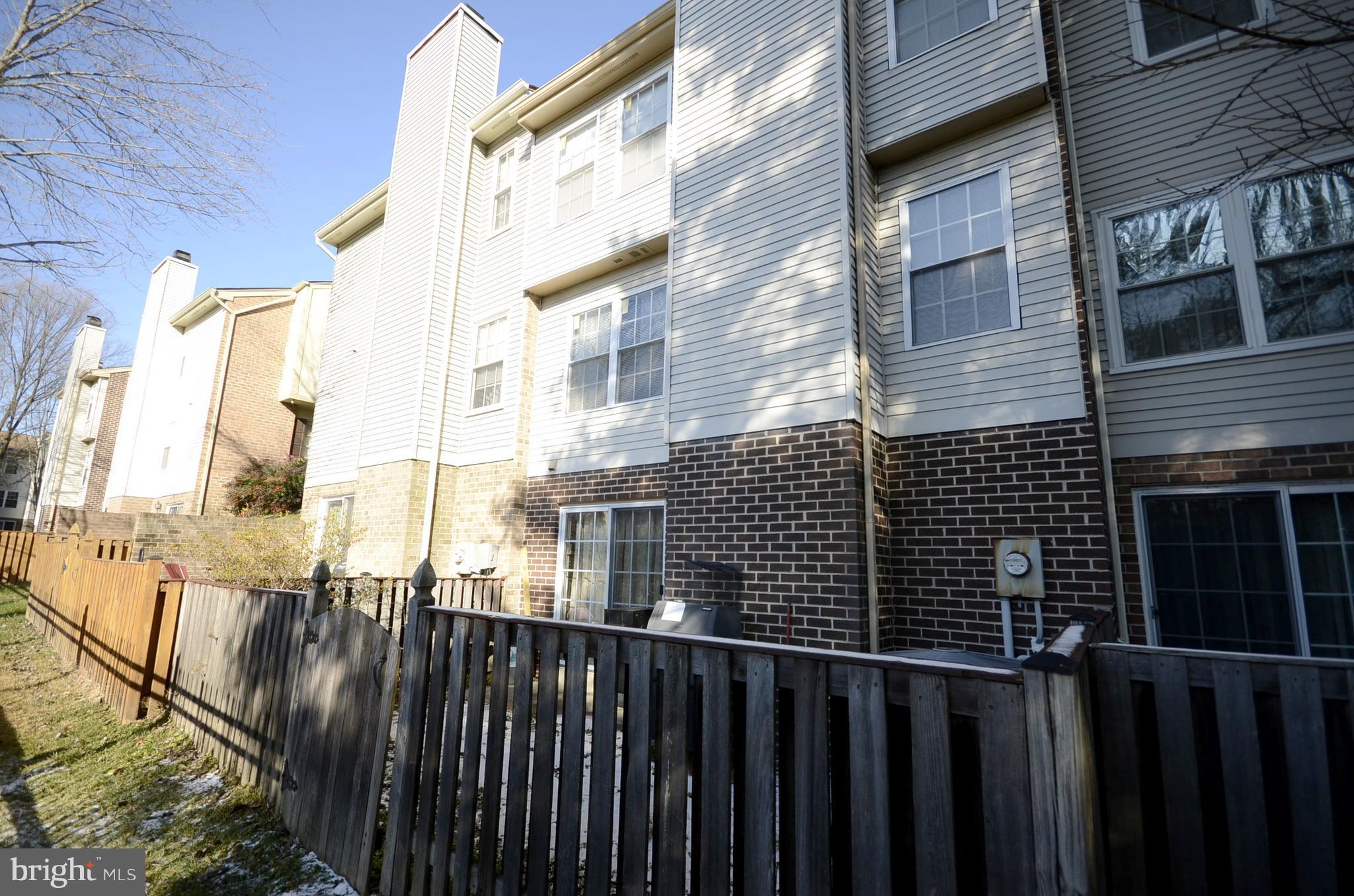 3504 Banquo Drive, Unit 893 Silver Spring, MD 20906 - Photo 23 of 23 a view of a brick building from a balcony
