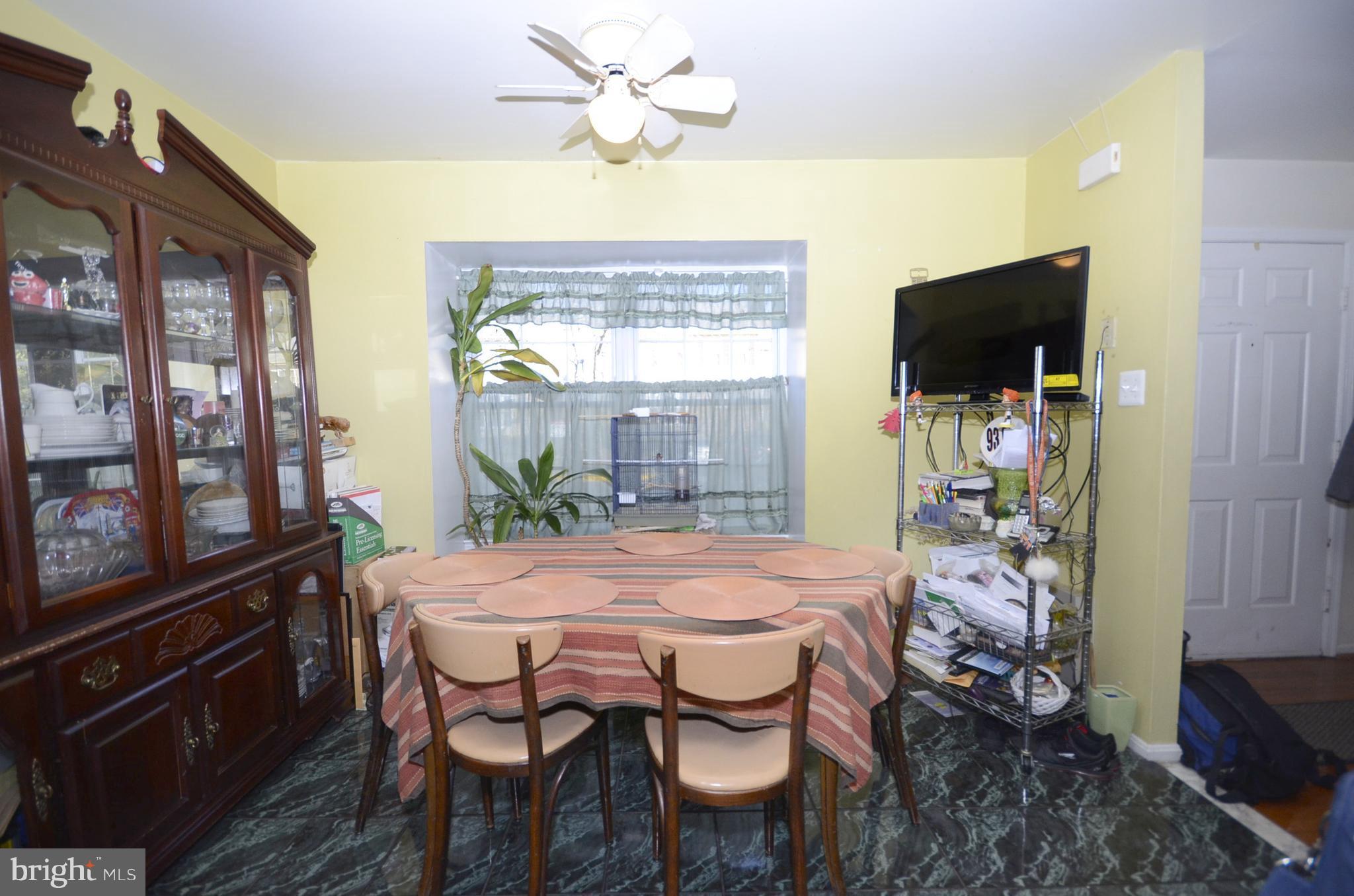 3504 Banquo Drive, Unit 893 Silver Spring, MD 20906 - Photo 6 of 23 a dining room with furniture and window
