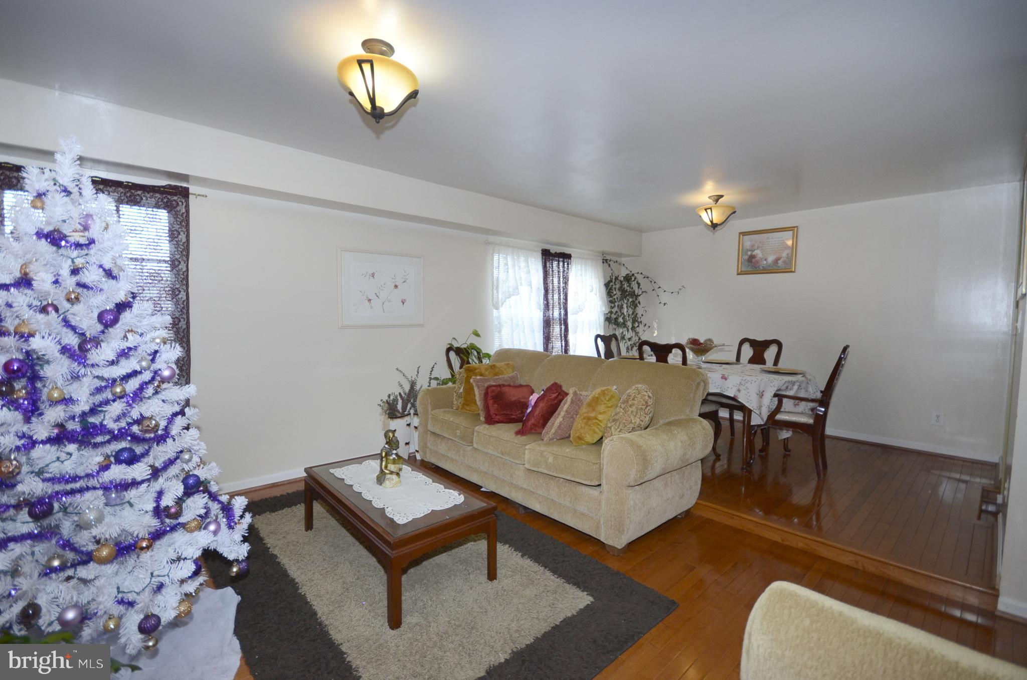 3504 Banquo Drive, Unit 893 Silver Spring, MD 20906 - Photo 8 of 23 a living room with furniture and a rug