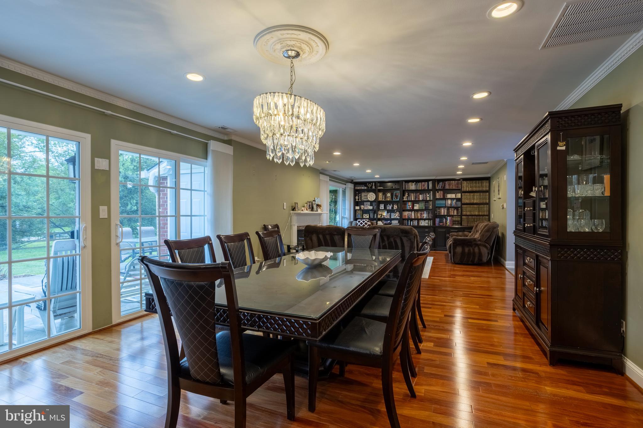 7908 Ivy Lane Baltimore, MD 21208 - Photo 13 of 90 a view of a dining room with furniture wooden floor and chandelier