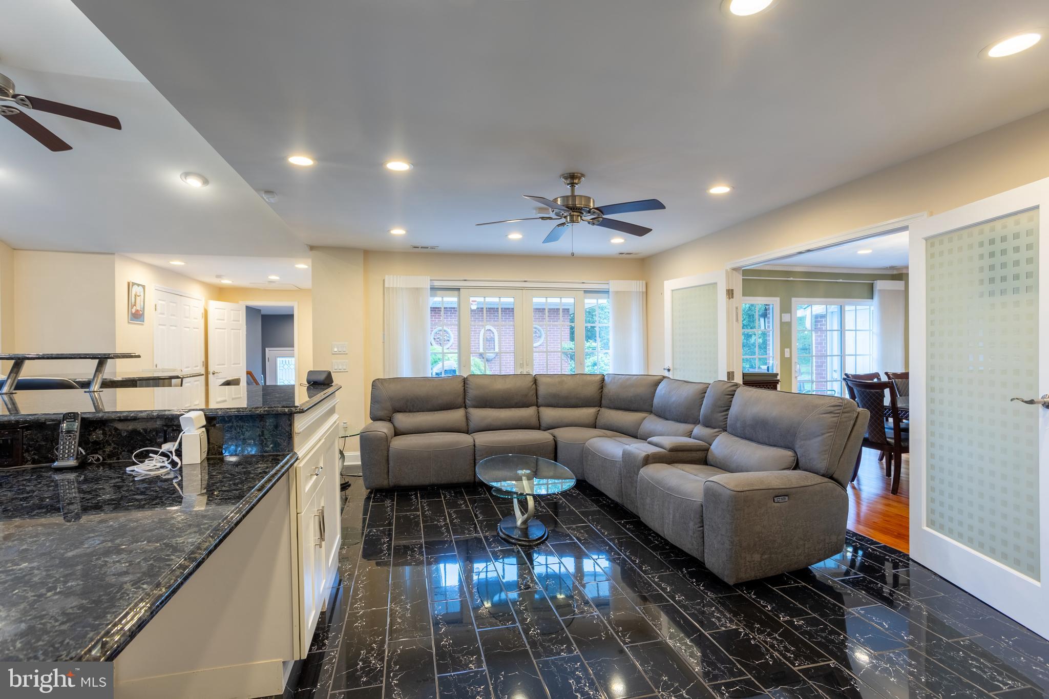 7908 Ivy Lane Baltimore, MD 21208 - Photo 26 of 90 a living room with furniture and a wooden floor