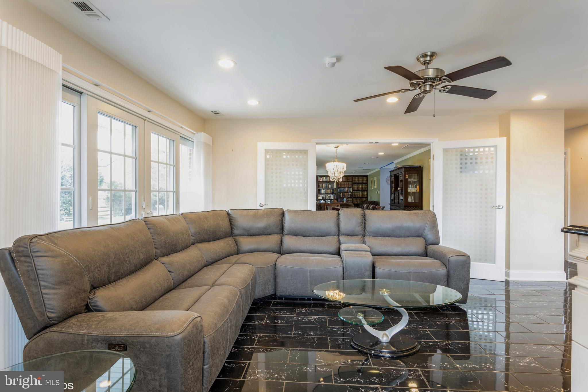 7908 Ivy Lane Baltimore, MD 21208 - Photo 27 of 90 a living room with furniture ceiling fan and a window