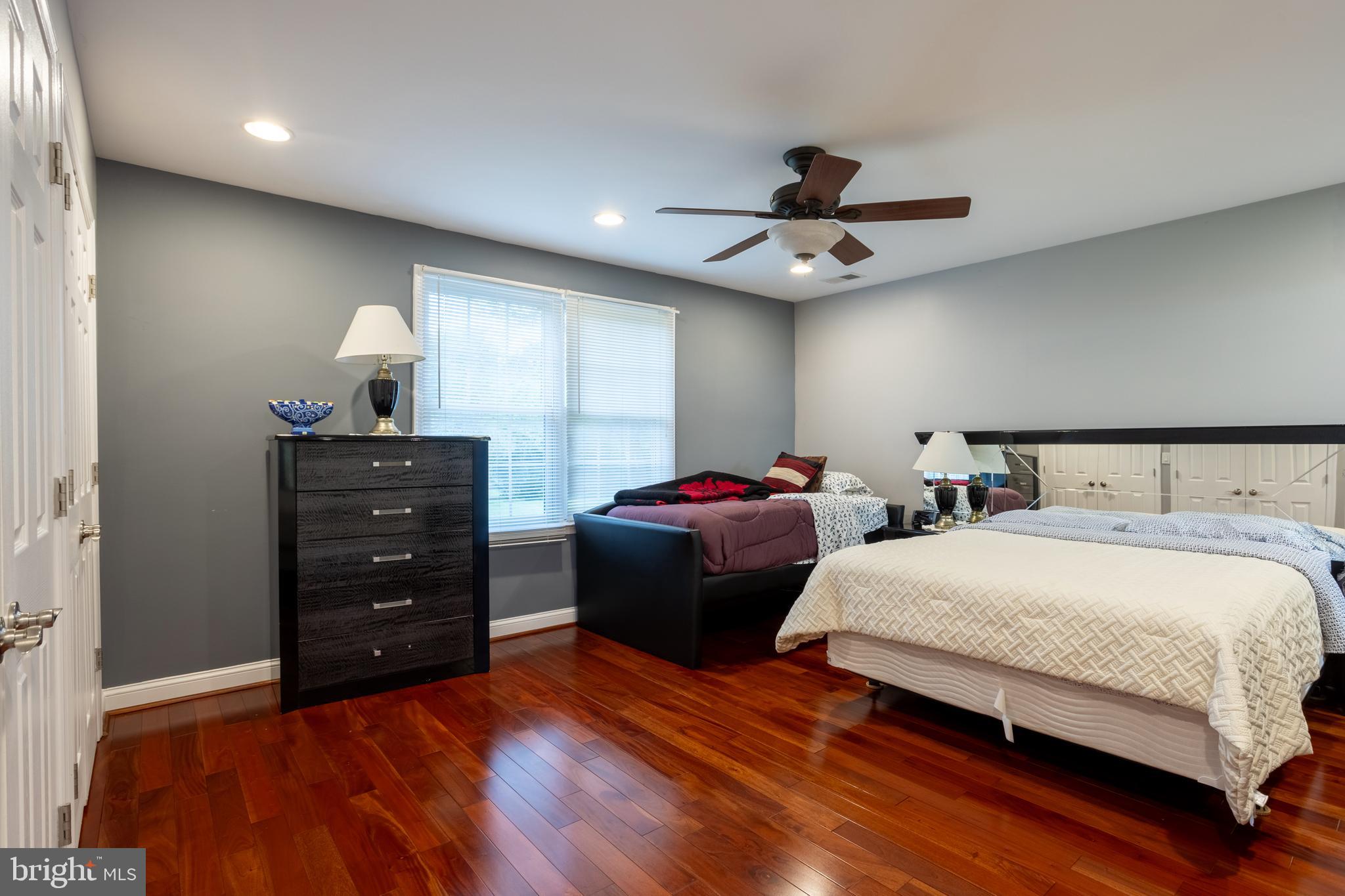 7908 Ivy Lane Baltimore, MD 21208 - Photo 33 of 90 a bedroom with a bed and a ceiling fan