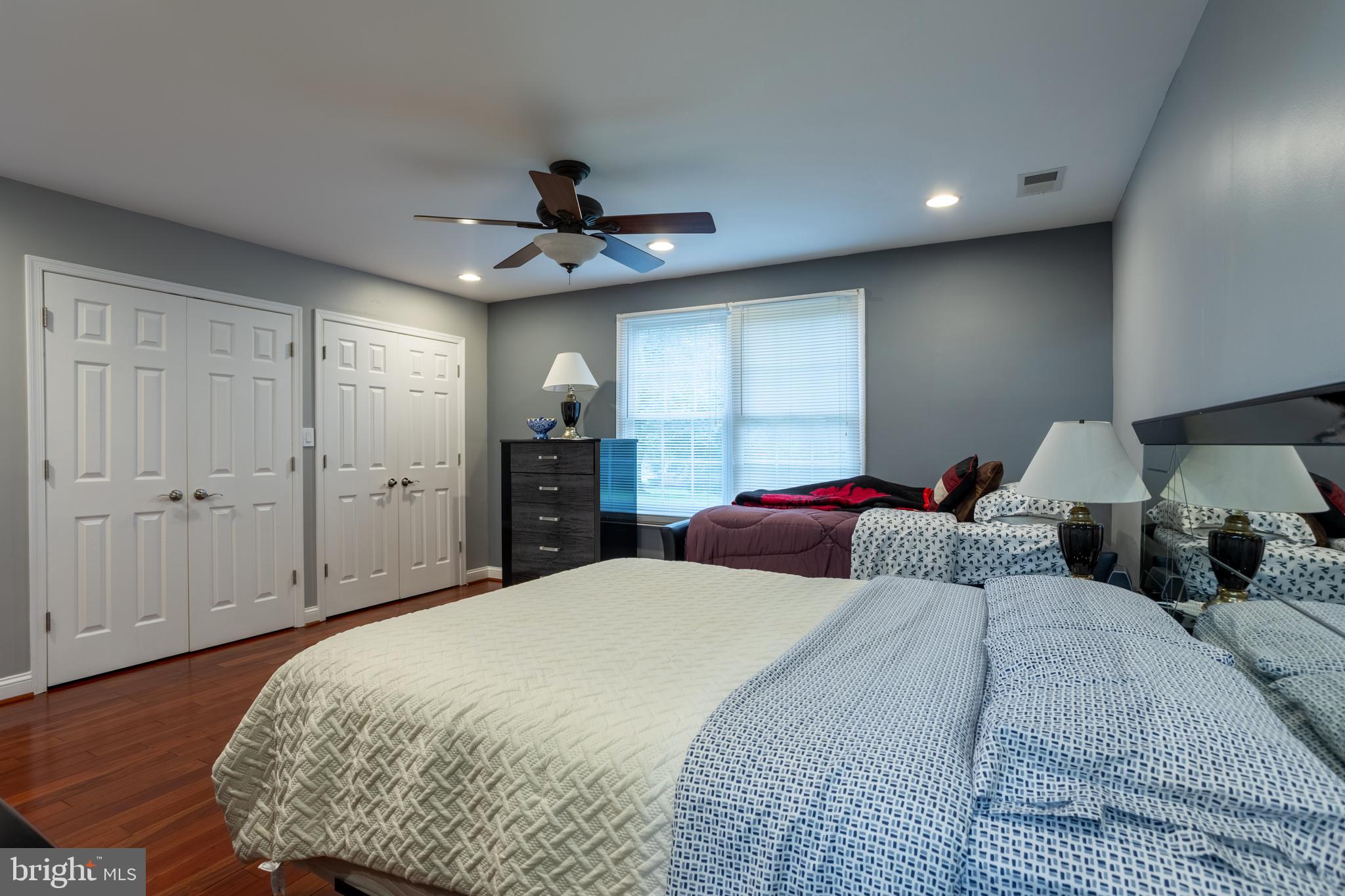 7908 Ivy Lane Baltimore, MD 21208 - Photo 34 of 90 a bedroom with a large bed and a chandelier