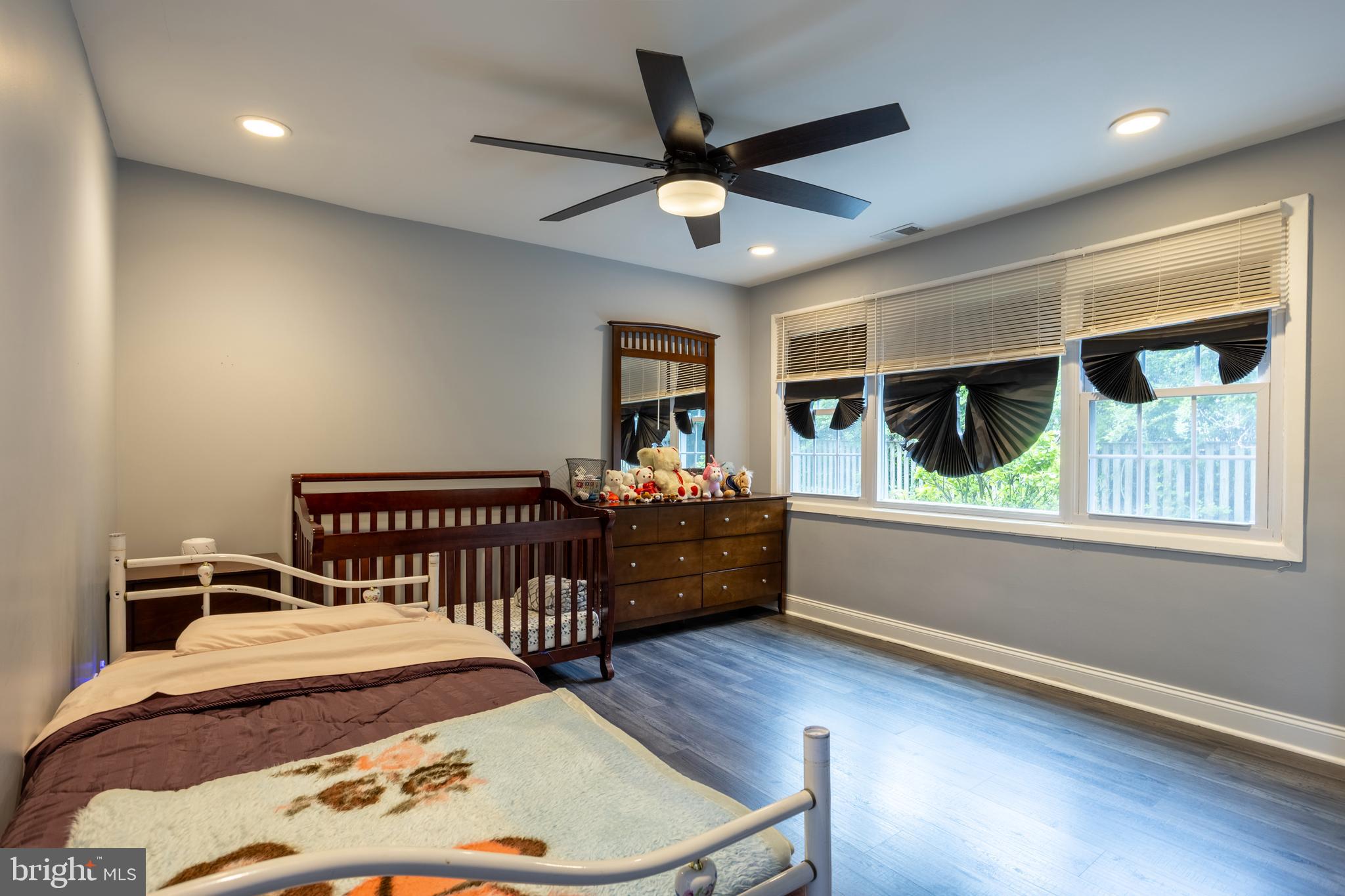 7908 Ivy Lane Baltimore, MD 21208 - Photo 39 of 90 a bedroom with a bed and a large window