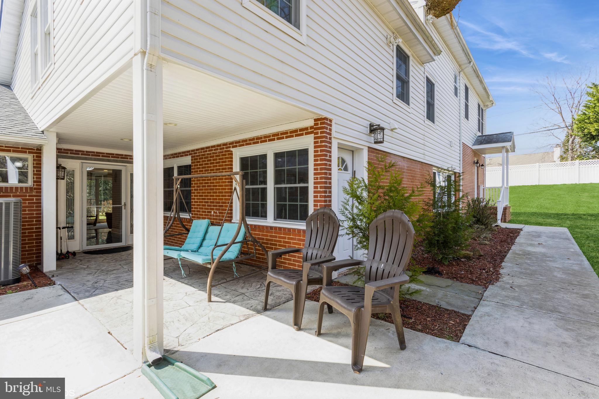 7908 Ivy Lane Baltimore, MD 21208 - Photo 4 of 90 a view of a patio with a table and chairs and potted plants