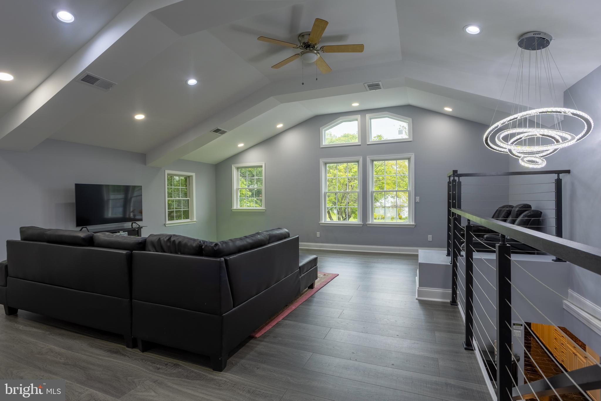 7908 Ivy Lane Baltimore, MD 21208 - Photo 56 of 90 a living room with furniture and a flat screen tv