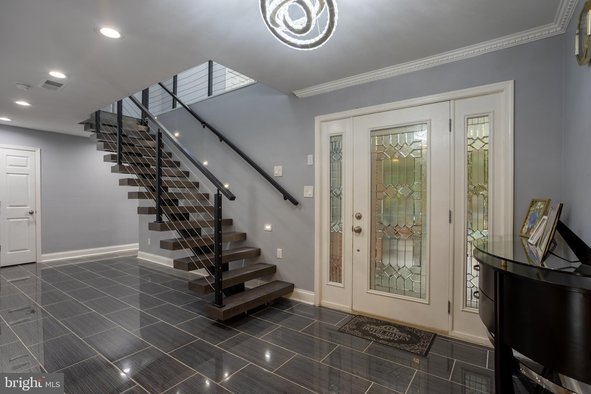 7908 Ivy Lane Baltimore, MD 21208 - Photo 6 of 90 a view of an entryway with wooden floor