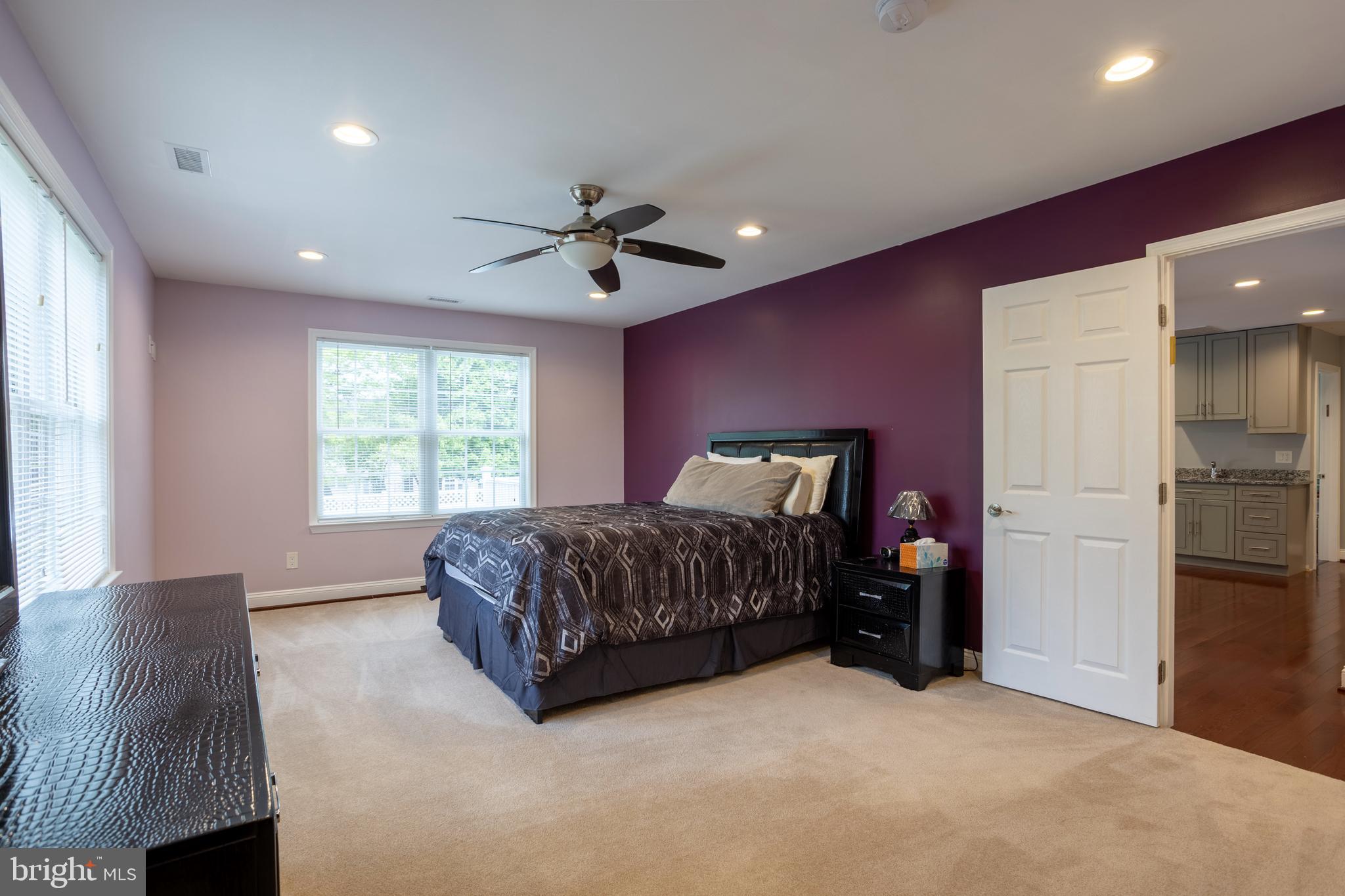 7908 Ivy Lane Baltimore, MD 21208 - Photo 69 of 90 a spacious bedroom with a bed and a window