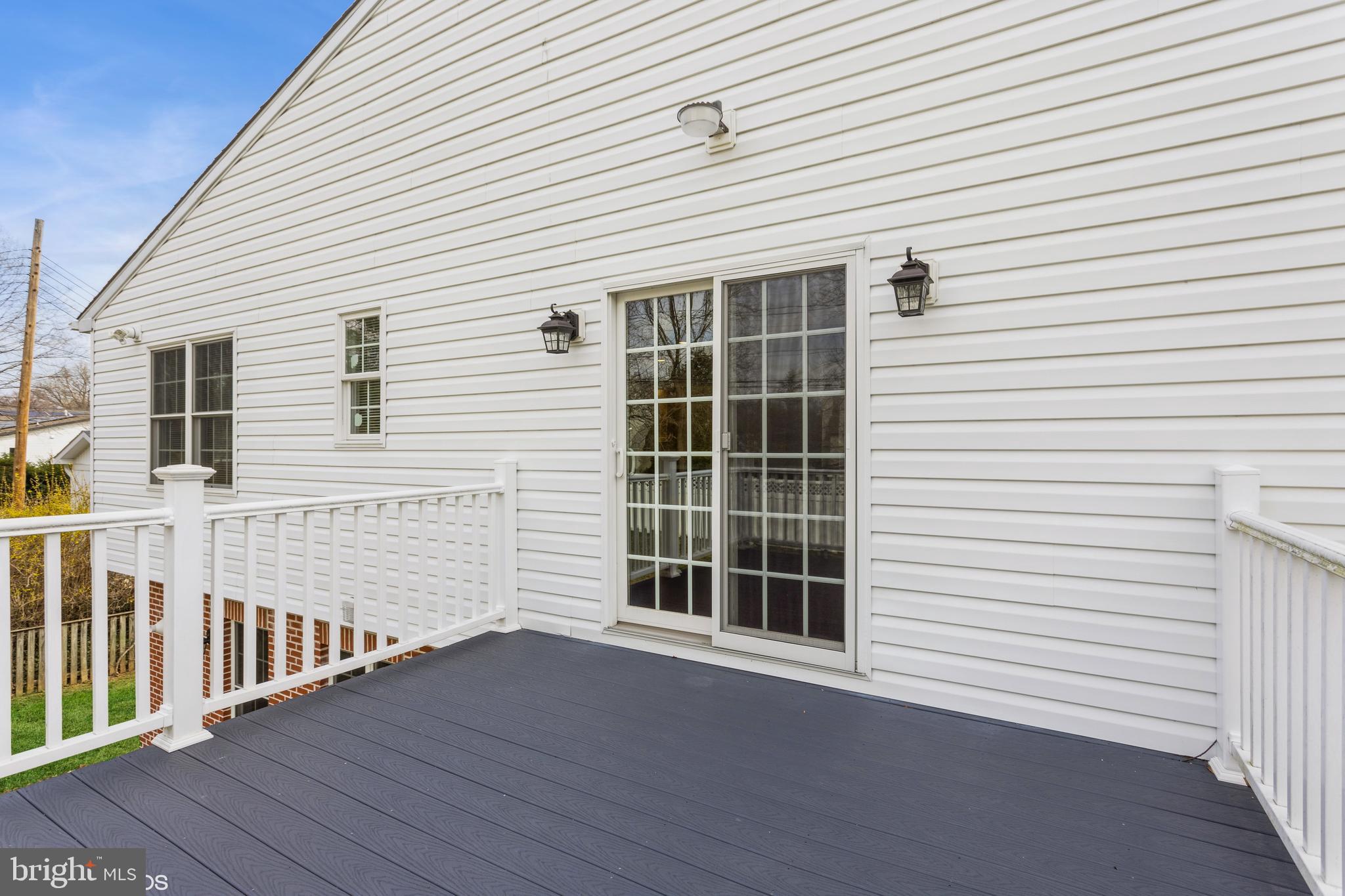7908 Ivy Lane Baltimore, MD 21208 - Photo 77 of 90 a view of a white house with wooden floor