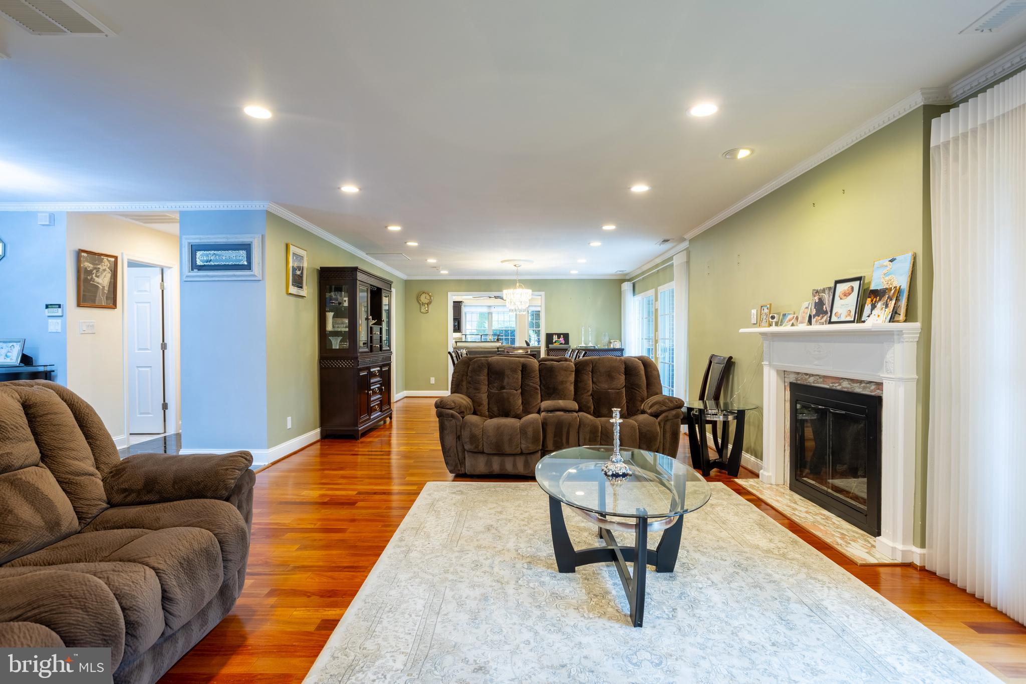 7908 Ivy Lane Baltimore, MD 21208 - Photo 10 of 90 a living room with furniture and a fireplace