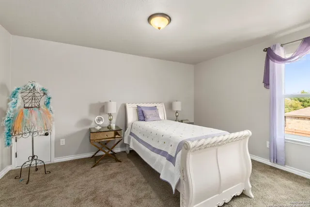 a bed room with a bed and a window