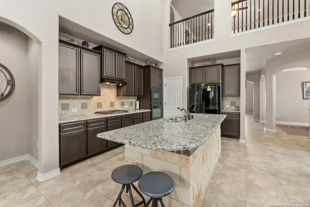 a kitchen with a table and chairs in it
