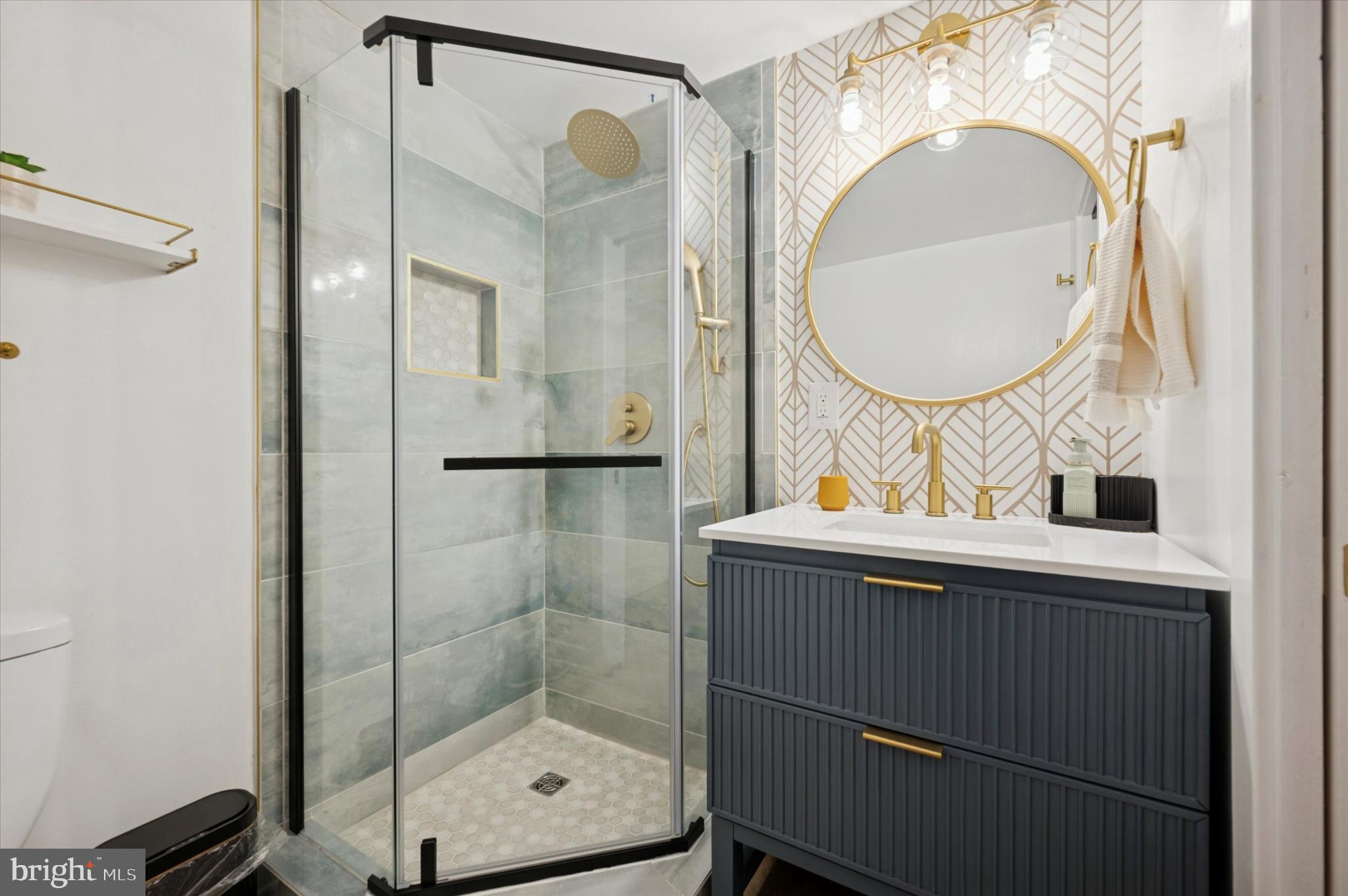 4128 Apple Street Philadelphia, PA 19127 - Photo 10 of 25 a bathroom with a sink mirror vanity and toilet