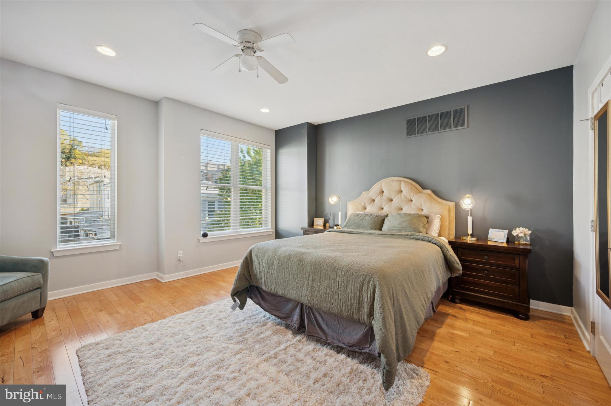 4128 Apple Street Philadelphia, PA 19127 - Photo 13 of 25 a bedroom with a bed and dresser with wooden floor