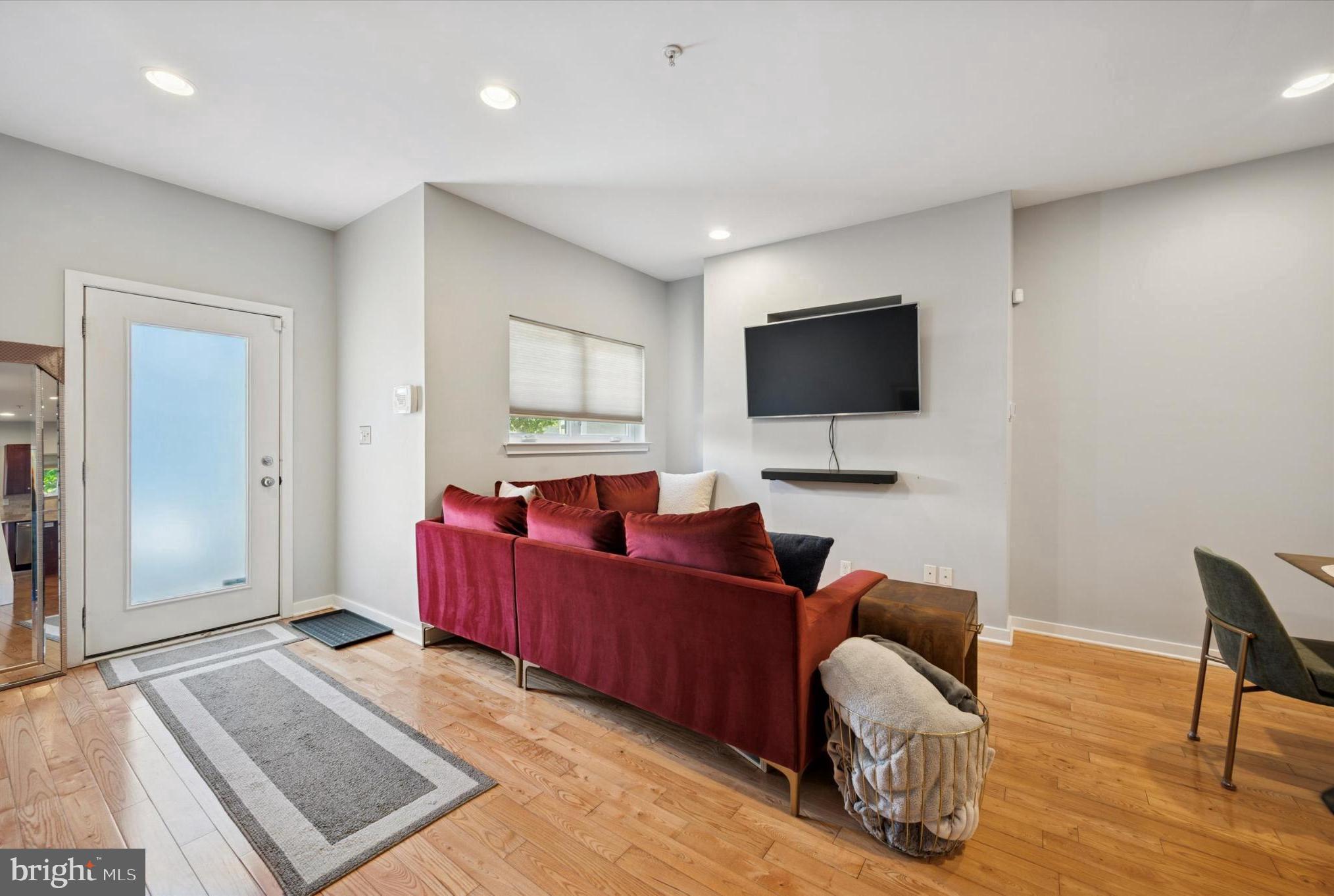 4128 Apple Street Philadelphia, PA 19127 - Photo 3 of 25 a living room with furniture and a flat screen tv