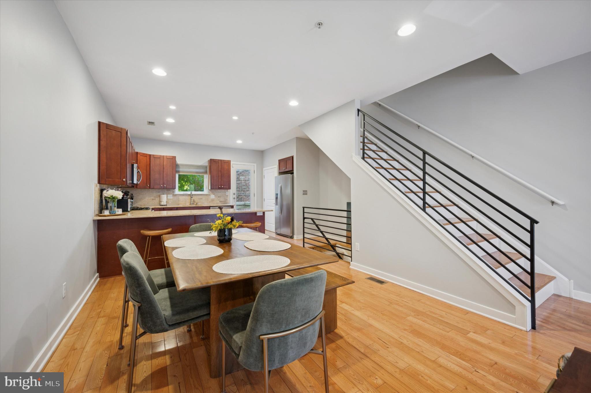 4128 Apple Street Philadelphia, PA 19127 - Photo 5 of 25 a kitchen with a dining table chairs and wooden floor