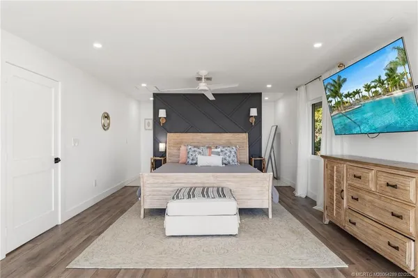 a bedroom with a bed and a view of bathroom