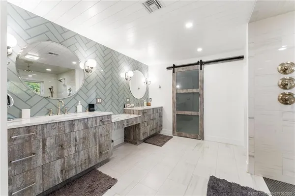 a bathroom with a bathtub and a shower