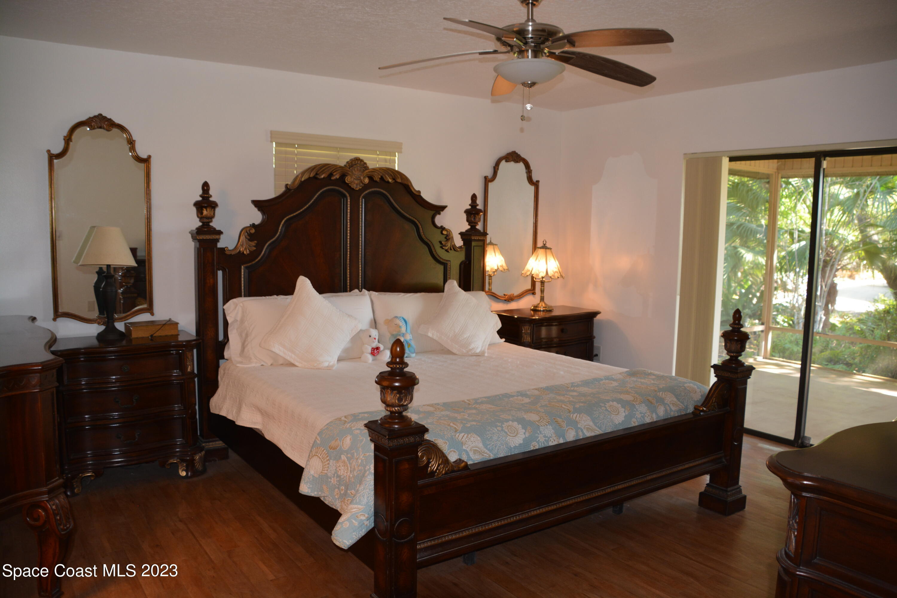 1045 Pine Island Road Merritt Island, FL 32953 - Photo 15 of 42 a bed room with a bed and dresser