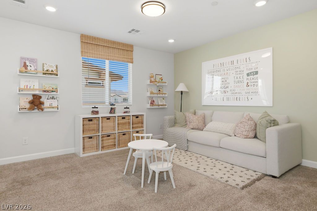 913 Cadence View Way Henderson, NV 89011 - Photo 25 of 46 A cheerful play area featuring built-in storage, plush carpeting, and bright overhead lighting.