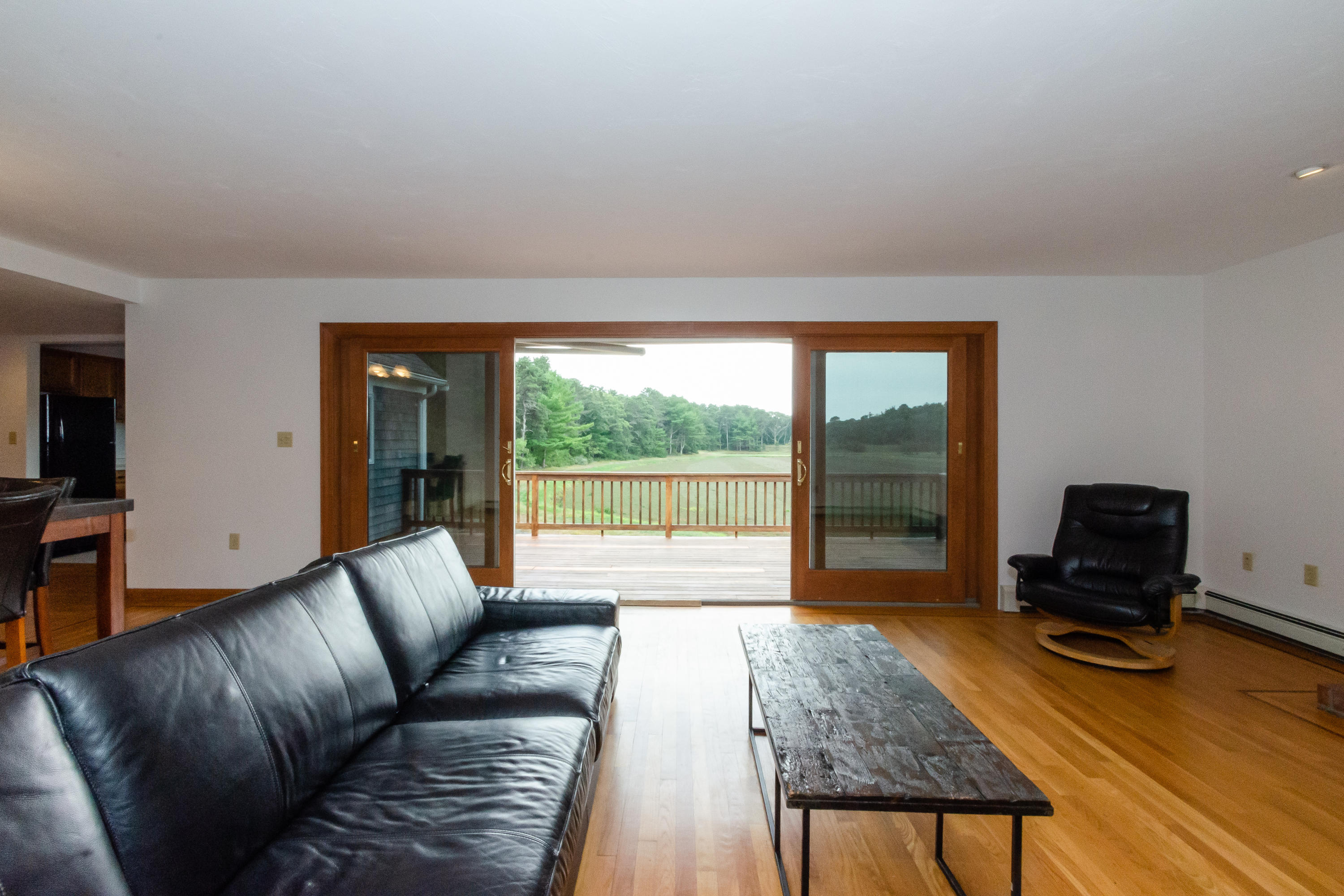 155-157 Great Neck Road Wareham, MA 02571 - Photo 38 of 45 a living room with furniture and a wooden floor