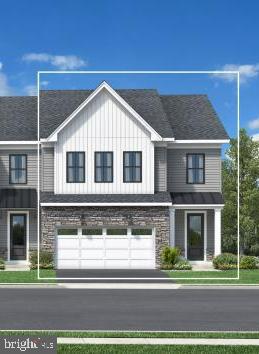 573 Trifecta Road, Unit 313 Downingtown, PA 19335 - Photo 1 of 66 a view of a brick house with a yard