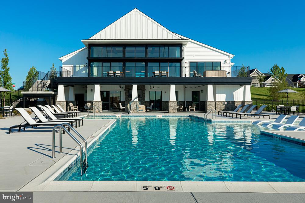 573 Trifecta Road, Unit 313 Downingtown, PA 19335 - Photo 26 of 37 a swimming pool view with a outdoor seating