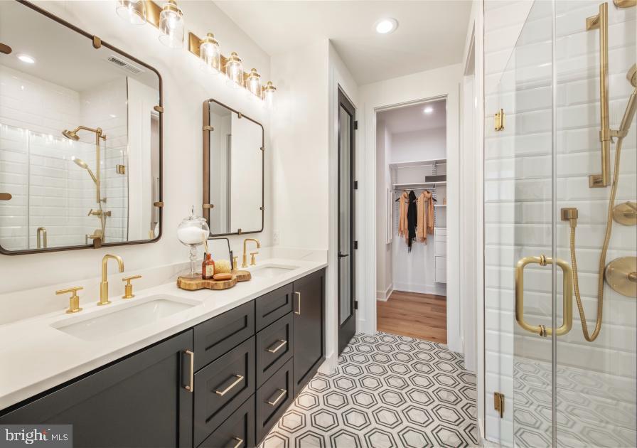 573 Trifecta Road, Unit 313 Downingtown, PA 19335 - Photo 51 of 66 a bathroom with a double vanity sink mirror and shower