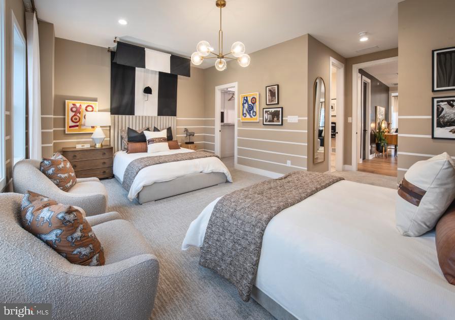 573 Trifecta Road, Unit 313 Downingtown, PA 19335 - Photo 53 of 66 a spacious bedroom with two beds and a large mirror