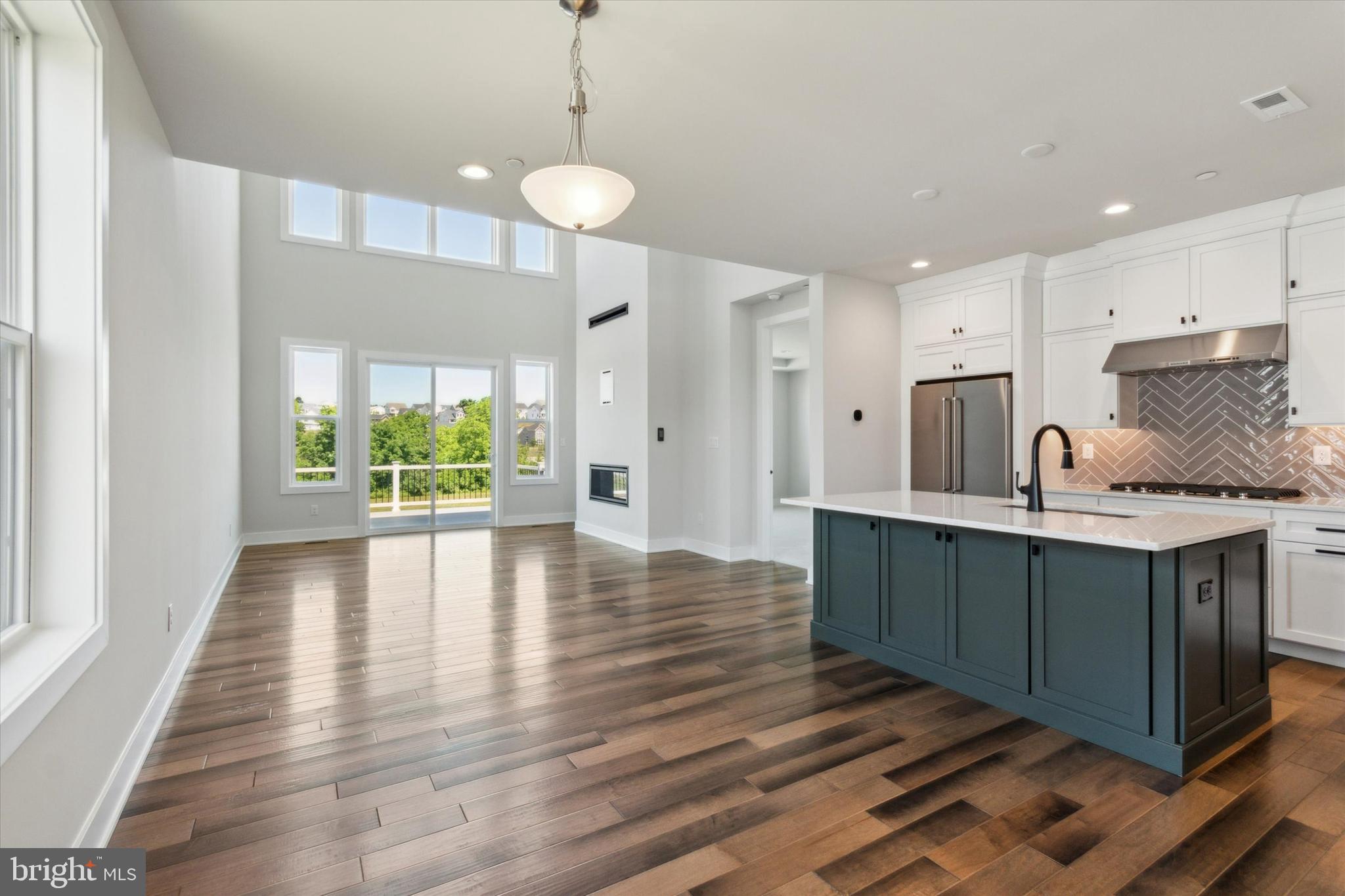 573 Trifecta Road, Unit 313 Downingtown, PA 19335 - Photo 7 of 66 a kitchen with stainless steel appliances granite countertop a stove refrigerator and cabinets