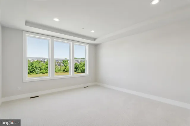 a bedroom with a bed and dresser