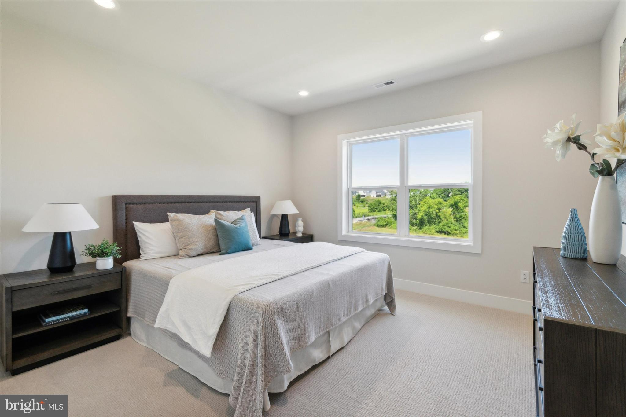 573 Trifecta Road, Unit 313 Downingtown, PA 19335 - Photo 8 of 37 a bedroom with a bed and a tv