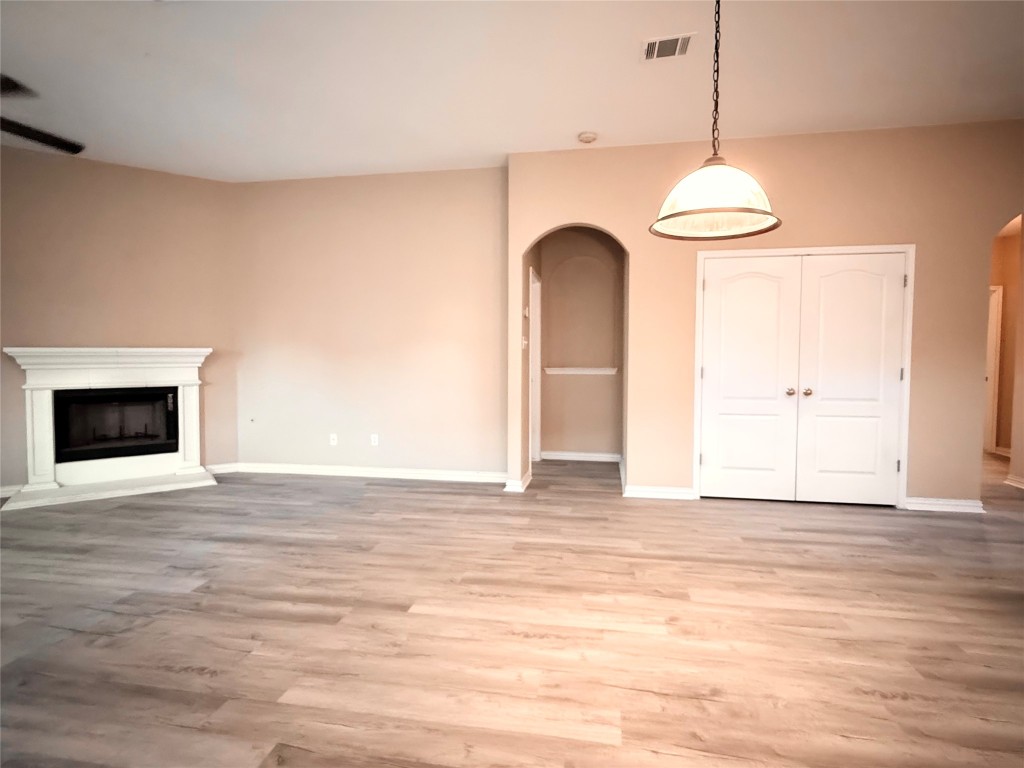 1548 Tonia Loop Round Rock, TX 78665 - Photo 11 of 29 a view of an empty room with wooden floor and a window