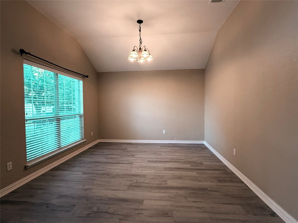 1548 Tonia Loop Round Rock, TX 78665 - Photo 15 of 29 an empty room with wooden floor and windows