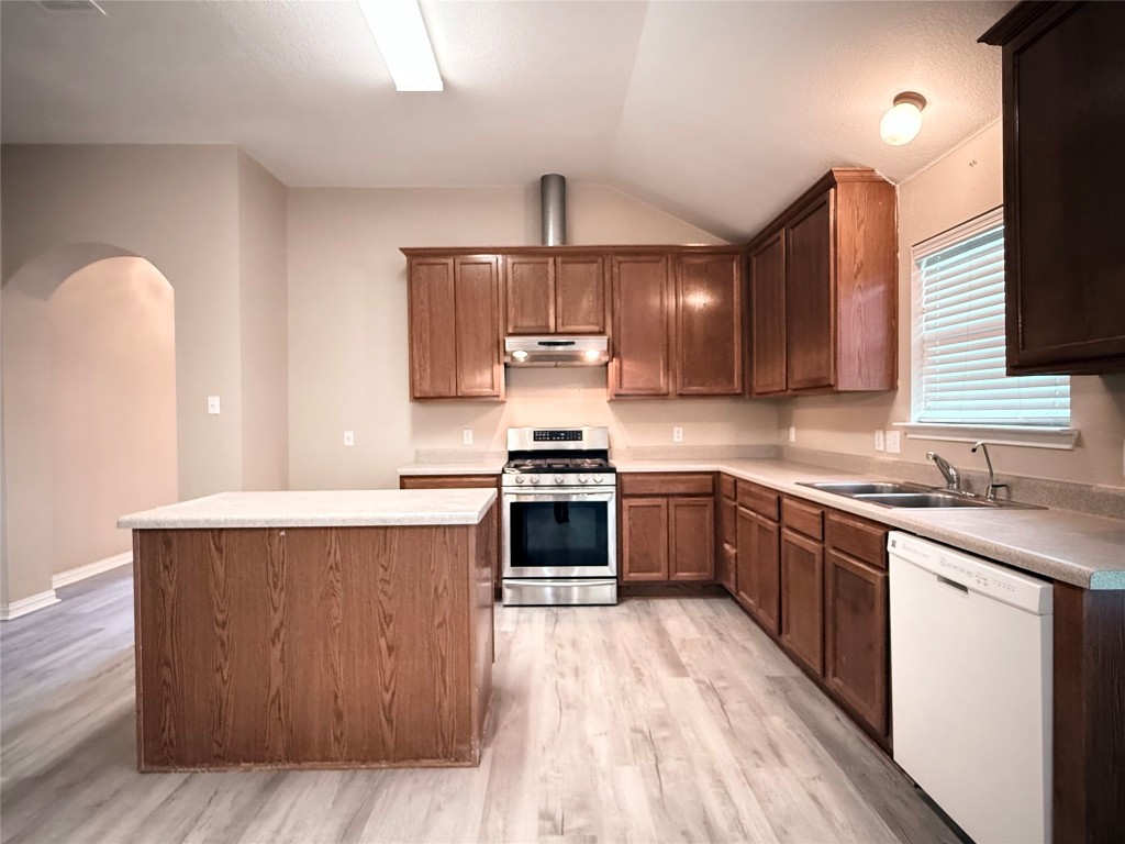 1548 Tonia Loop Round Rock, TX 78665 - Photo 10 of 29 a kitchen with a stove and a sink