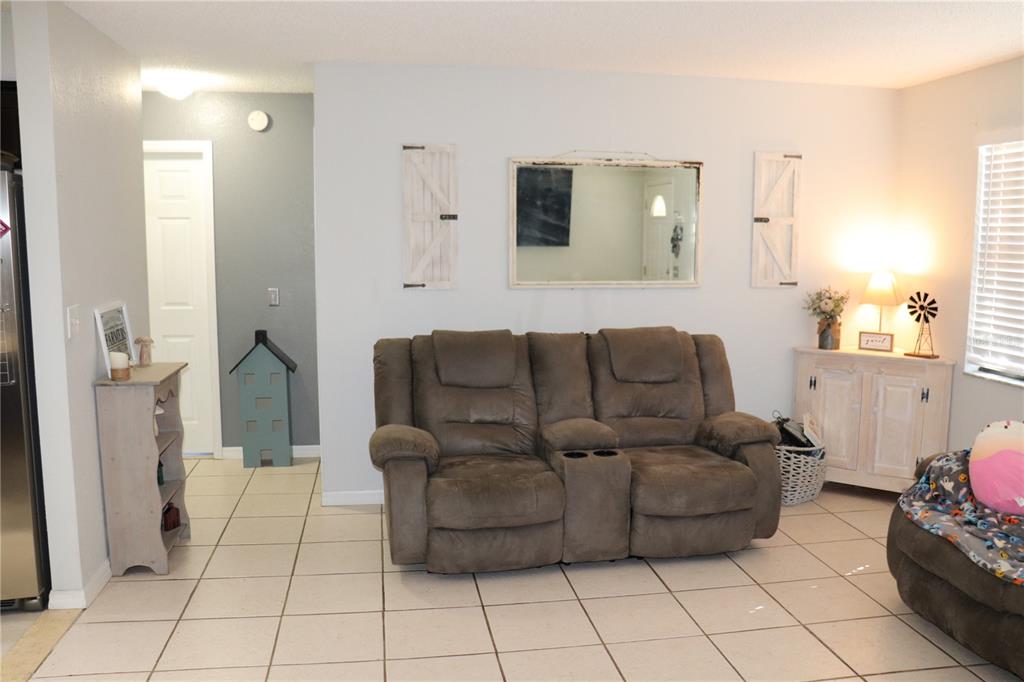 12387 Seagate Street Spring Hill, FL 34609 - Photo 11 of 51 a living room with furniture and a window