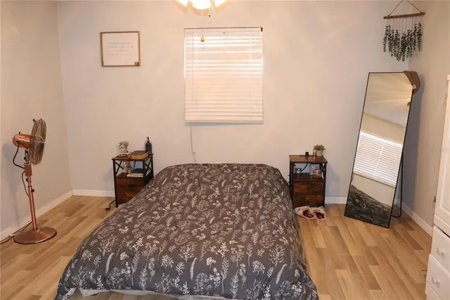 a bedroom with a bed and a table in it