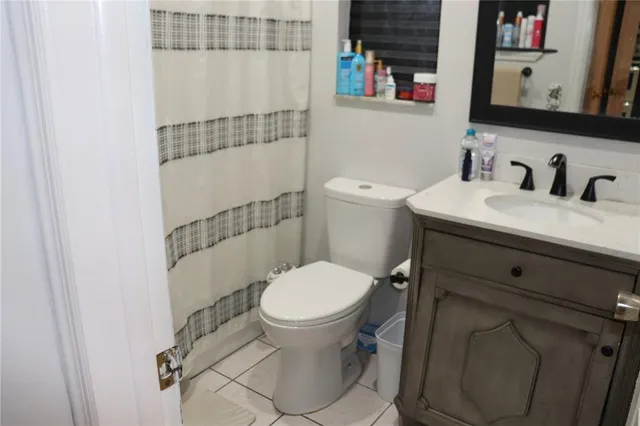 a bathroom with a toilet and a sink