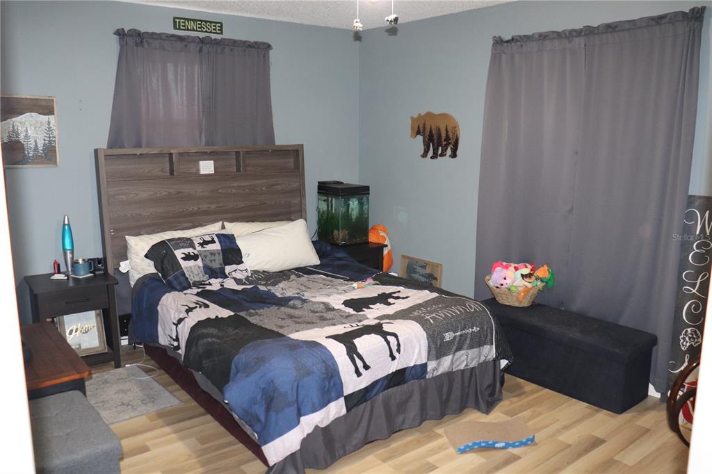 12387 Seagate Street Spring Hill, FL 34609 - Photo 18 of 51 a bedroom with bed and a window