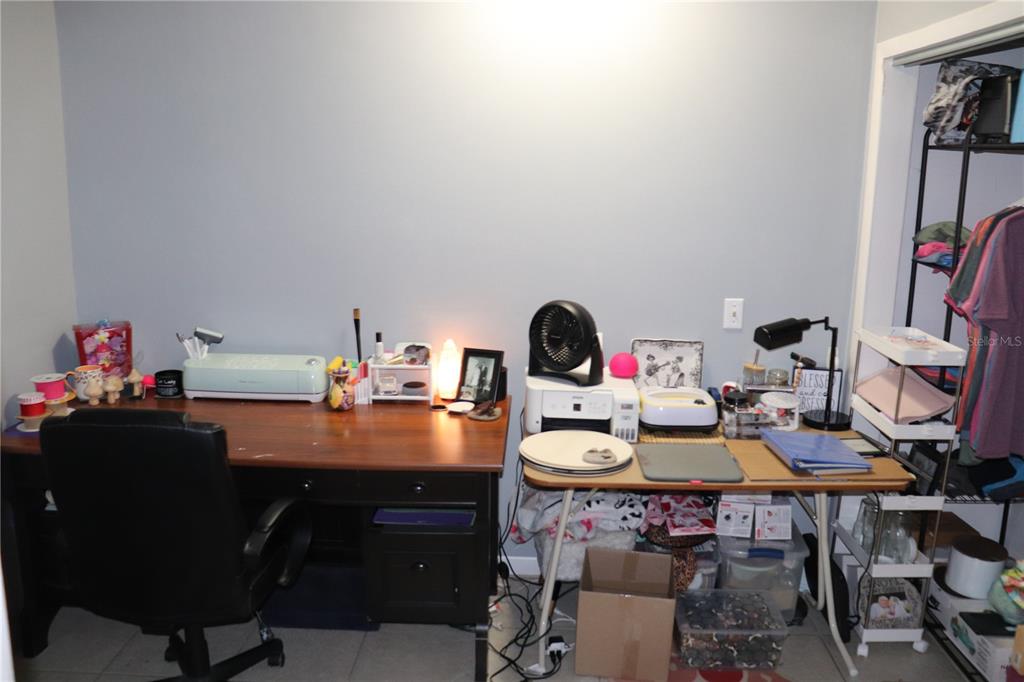 12387 Seagate Street Spring Hill, FL 34609 - Photo 27 of 51 a room with furniture and a couch