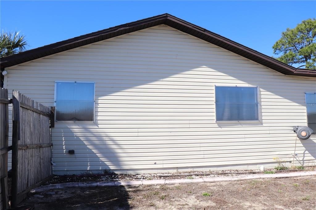 12387 Seagate Street Spring Hill, FL 34609 - Photo 32 of 51 a view of a house with a yard